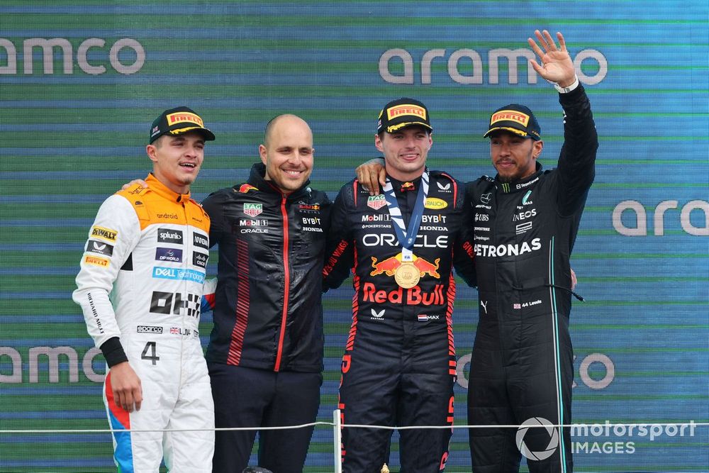 Lando Norris, McLaren, 2nd position, the Red Bull trophy delegate, Max Verstappen, Red Bull Racing, 1st position, Lewis Hamilton, Mercedes-AMG, 3rd position, on the podium