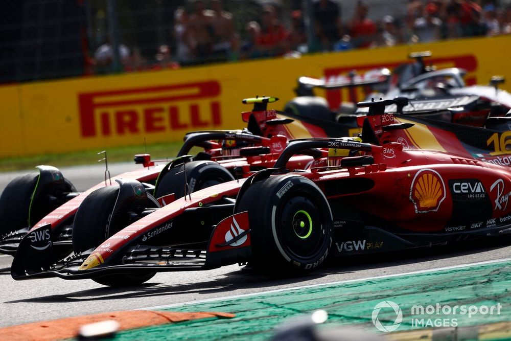 Charles Leclerc, Ferrari SF-23, battles with Carlos Sainz, Ferrari SF-23