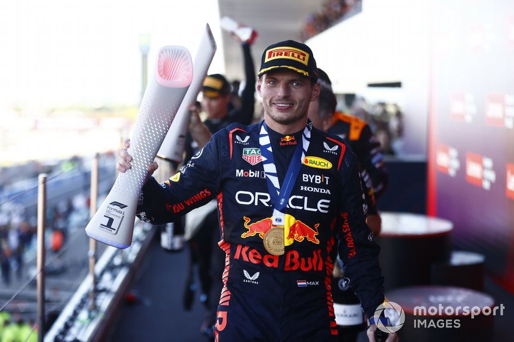 Max Verstappen, Red Bull Racing, 1st position, leaves the podium with his trophy 