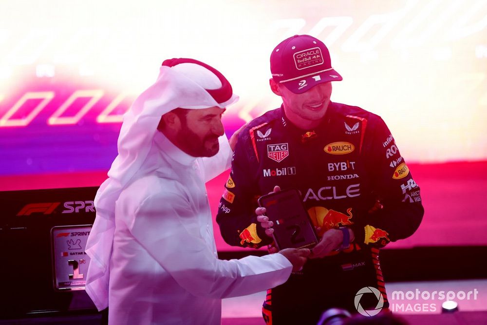 Max Verstappen, Red Bull Racing, 2nd position and 2023 drivers world champion, receives his Sprint race trophy from Mohammed ben Sulayem, President, FIA