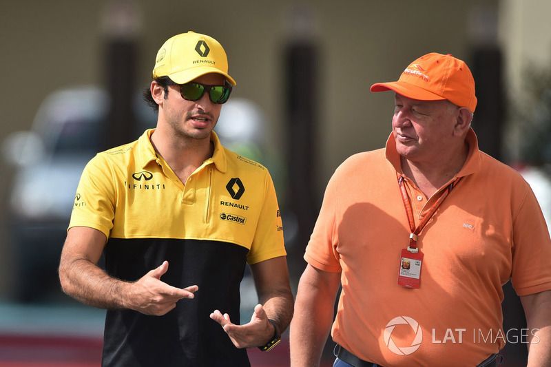 Carlos Sainz Jr driving for Renault Sport F1 Team in 2017 alongside Dieter Rencken, Journalist