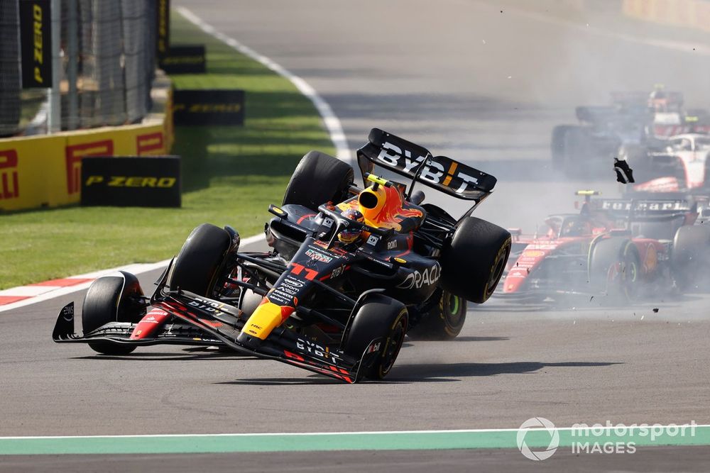 Charles Leclerc, Ferrari SF-23, Sergio Perez, Red Bull Racing RB19, make contact at the start causing the Mexican to crash out