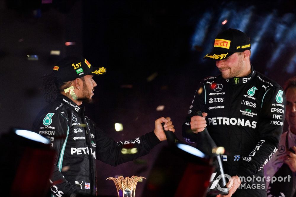 Lewis Hamilton, Mercedes, 1st position, and Valtteri Bottas, Mercedes, 3rd position, celebrate on the podium