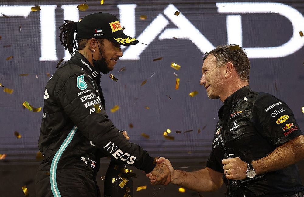 Red Bull Racing Team Principal Christian Horner shakes hands with second placed Lewis Hamilton, Mercedes