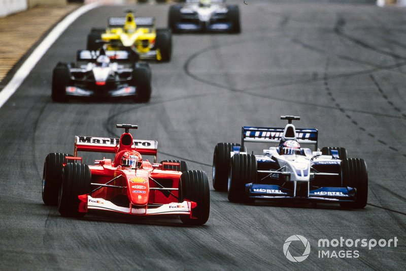 Michael Schumacher, Ferrari F2001, battles with Juan Pablo Montoya, Williams FW23 BMW