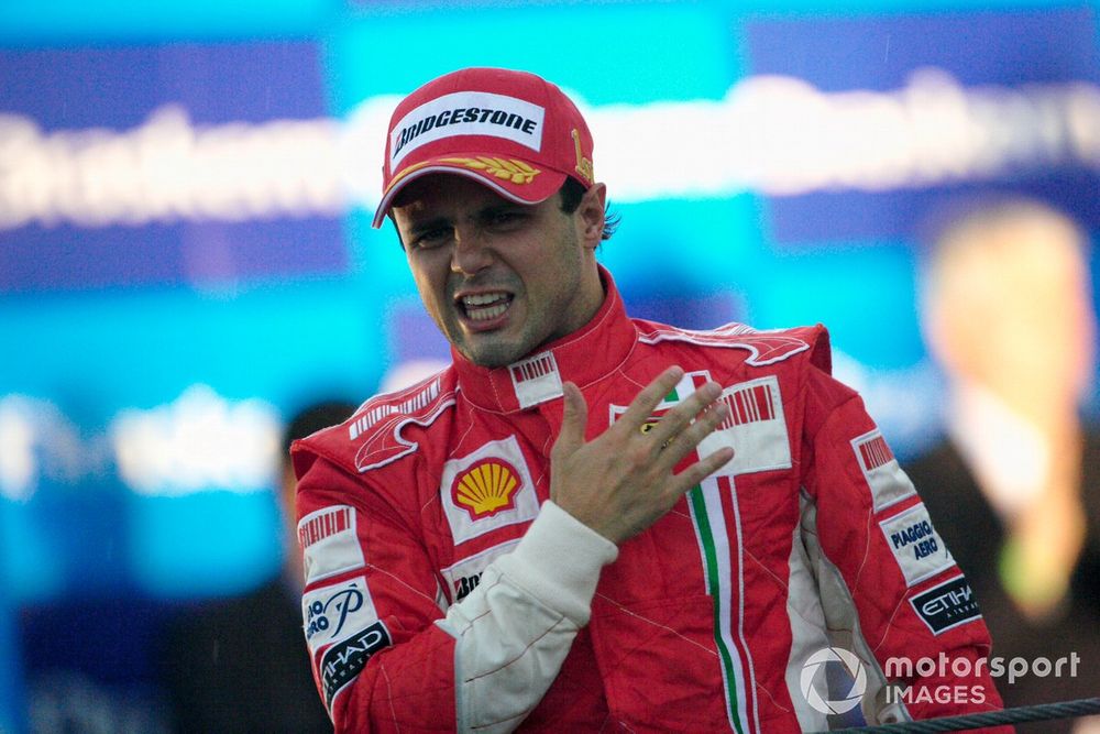 An emotional Felipe Massa proudly slaps the Prancing Horse insignia on his chest as he celebrates victory and a well fought season in front of his home fans.