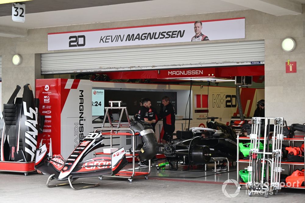 Team members of Haas F1 Team at work in the garage 