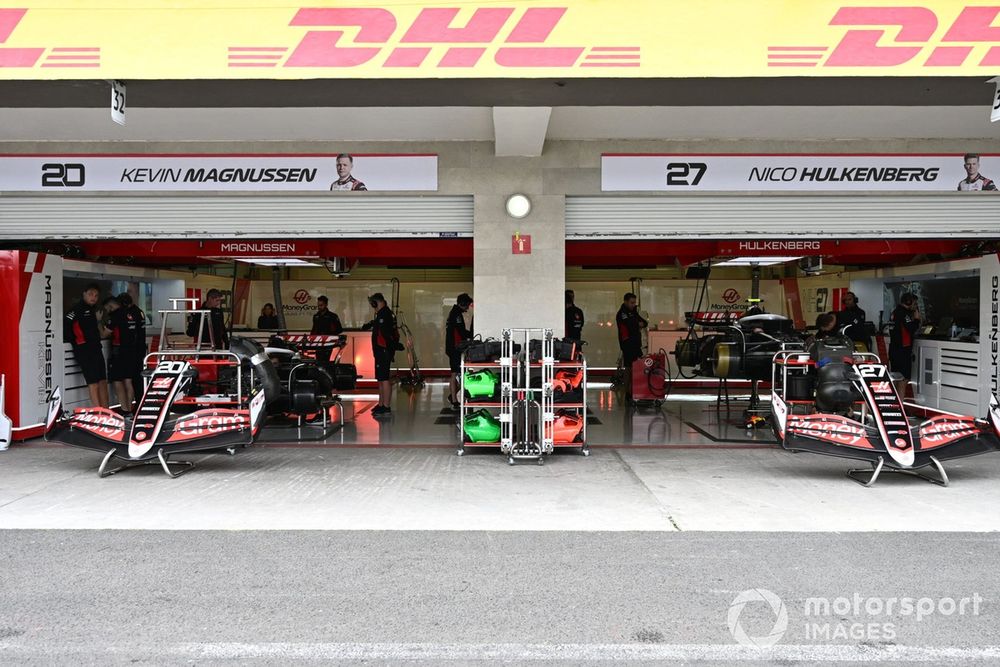 Team members of Haas F1 Team at work in the garage 