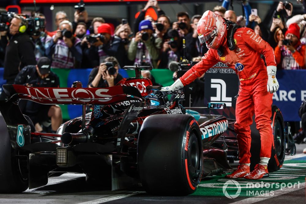 Carlos Sainz, Scuderia Ferrari, congratulates pole man George Russell, Mercedes F1 W15