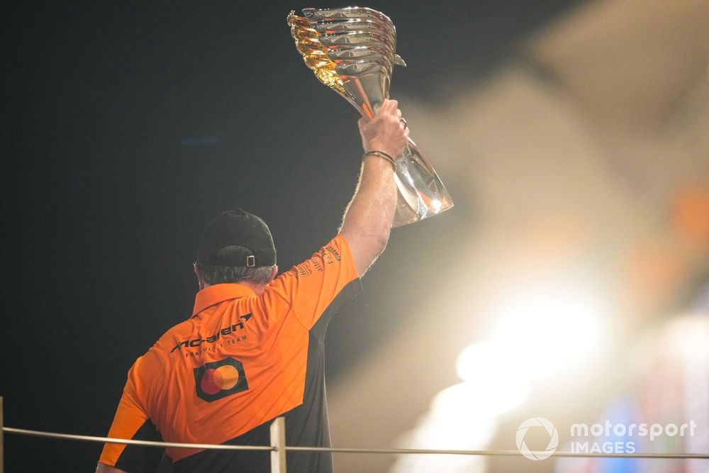 Zak Brown, CEO, McLaren Racing, lifts the Constructors trophy on the podium